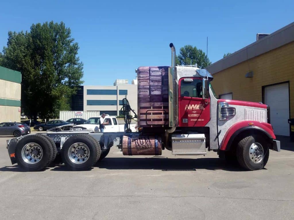 A Semi-Truck Wrapped By Summit Signs